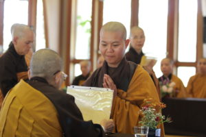 Sr. Thanh Đoan receiving Precepts at Great Precepts Transmission Ceremony 2021