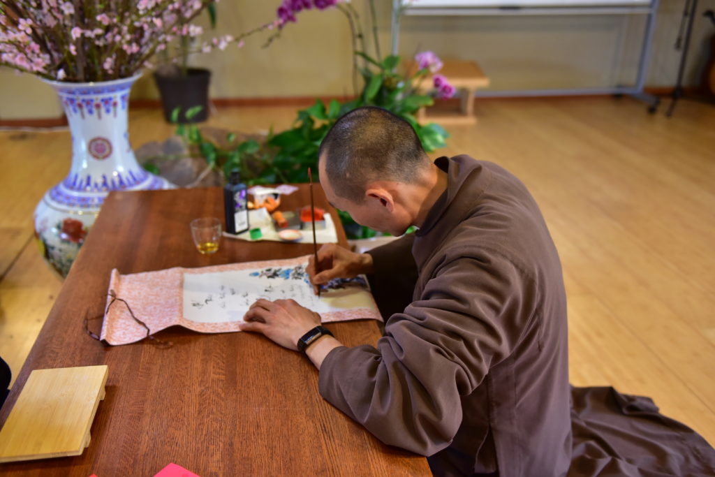 Monk drawing calligraphy 